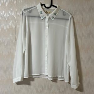Hollister semi-sheer button down shirt with beading at the collar (medium size).